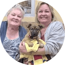 2 HALO adopters and their puppy